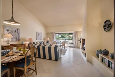 a living room with a couch and a table at Mng Elliott13 in Vale do Lobo