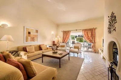 a living room with a couch and a table at Mng Elliott74 in Vale do Lobo