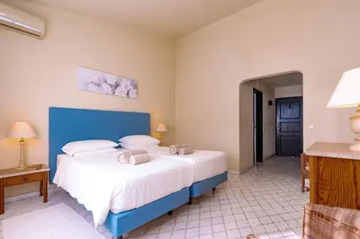a bedroom with a large bed with towels on it at Mng Elliott74 in Vale do Lobo