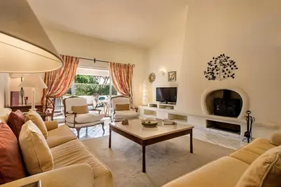 a living room with a couch and a table at Mng Elliott74 in Vale do Lobo