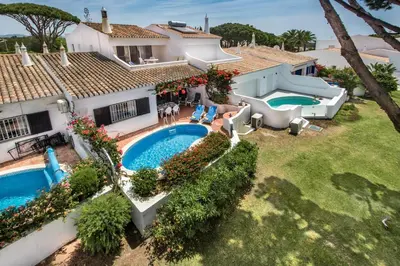 an aerial view of a house with a swimming pool at Mng Elliott71 in Vale do Lobo