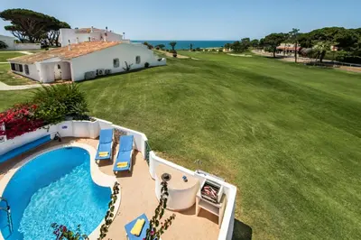 an aerial view of a house and a swimming pool at Mng Elliott51 in Vale do Lobo