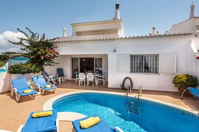 a view of the house from the yard at Mng Elliott51 in Vale do Lobo