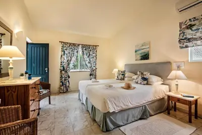 a bedroom with a large bed in a room at Mng Elliott49 in Almancil