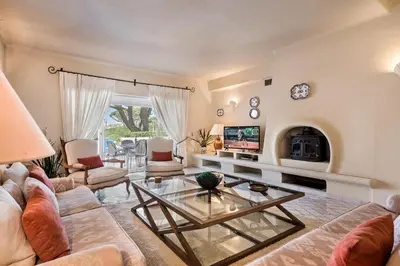 a living room with a couch and a table at Mng Elliott37 in Vale do Lobo