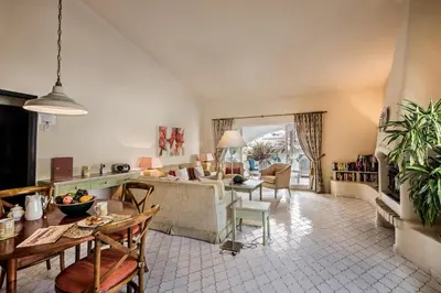 a living room with a couch and a table at Mng Elliott31 in Almancil
