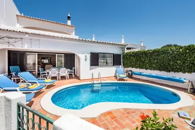 a swimming pool in the backyard of a house at Mng Elliott46 in Vale do Lobo