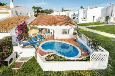 an aerial view of a house with a swimming pool at Mng Elliott42 in Vale do Lobo