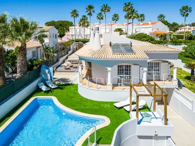 an aerial view of a house with a swimming pool at Vicente Mar Luxury Villa - Private Pool in Albufeira