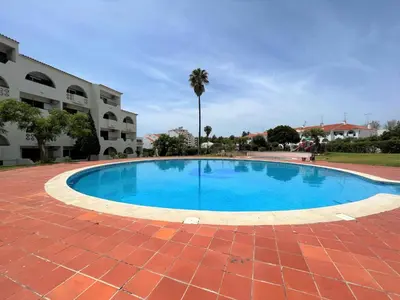 a large swimming pool in front of a building at Albufeira Twins 3 With Pool by Homing in Albufeira