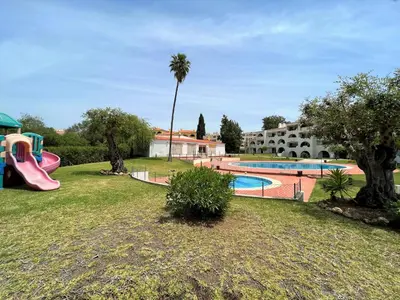 a resort with a pool and a playground at Albufeira Twins 3 With Pool by Homing in Albufeira