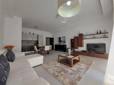 a living room with a couch and a table at Al Baltum in Albufeira