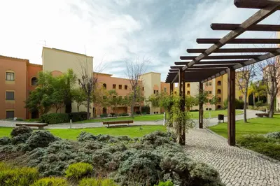 a courtyard of a building with a pavilion at The Residences Vilamoura in Vilamoura