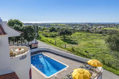 a villa with a swimming pool and a view at Villa Casa Coelho by Villa Plus in Terras Novas