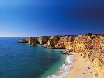 a view of a beach with rocks and the ocean at Beach&Golf Vilamoura Apartment in Vilamoura