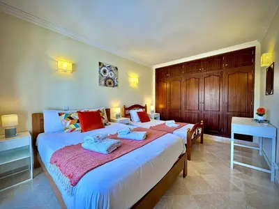 a bedroom with two beds with towels on them at Albufeira Summer Villa 1 With Pool by Homing in Albufeira