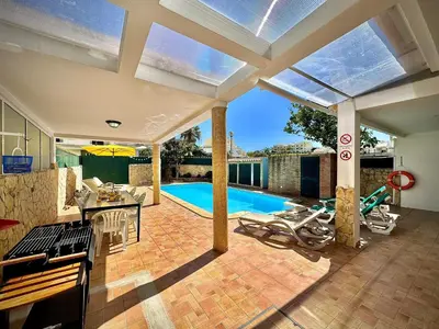 a kitchen and living room with a swimming pool at Albufeira Summer Villa 1 With Pool by Homing in Albufeira