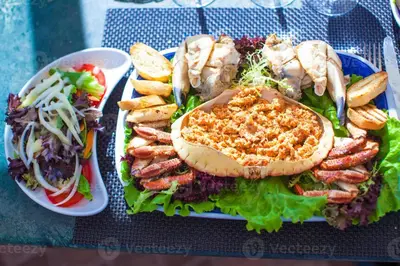 a plate of food with a sandwich and a salad at Albufeira Summer Villa 1 With Pool by Homing in Albufeira