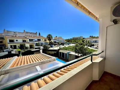 a balcony with a view of a pool and buildings at Albufeira Summer Villa 1 With Pool by Homing in Albufeira
