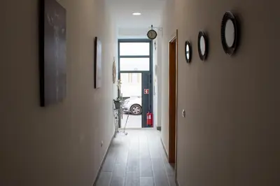a hallway with a view of a hallway with a car at Casa Amarela - Conforto e localização central! in Faro