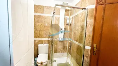 a bathroom with a toilet and a glass shower at Villa GP by Sunny Deluxe in Albufeira