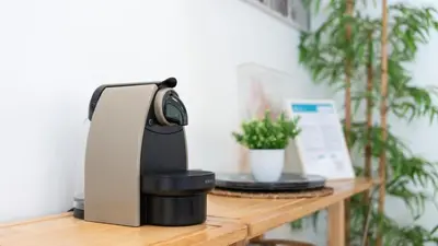 a coffee machine sitting on a wooden table at Relaxing Beach House in Alfamar by LovelyStay in Albufeira