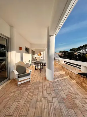 a living room with a view of the ocean at Casa Vale do Lobo in Vale do Lobo