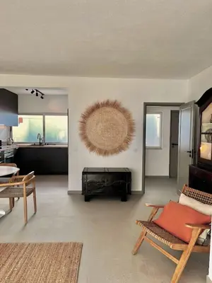 a living room with a couch and a table at Casa Vale do Lobo in Vale do Lobo