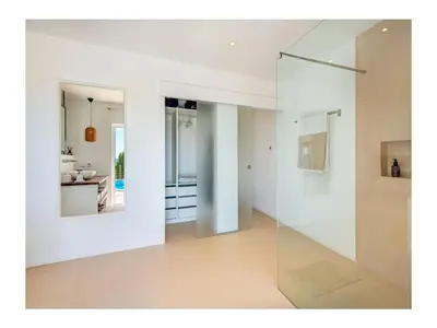 a white room with a glass wall at Casa Monte Algarve Comfortable holiday residence in Loulé