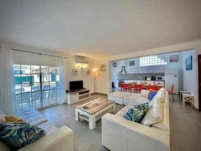 a living room with a couch and a table at Albufeira Summer Villa 2 with Pool by Homing in Albufeira