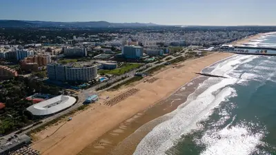 an aerial view of a beach and the ocean at T3 Triplex Vista Mar Marina de Vilamoura-Greice Homes in Vilamoura