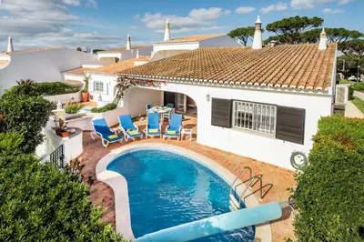 an aerial view of a white house with a yard at Mng Elliott55 in Vale do Lobo