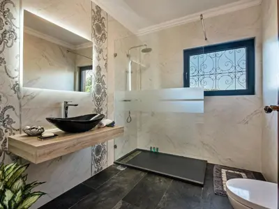 a bathroom with a sink and a mirror at Villa Vera VIP Properties by Interhome in Vilamoura