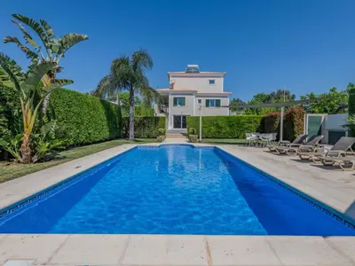 a villa with a swimming pool and a house at Villa Carmen by Interhome in Terras Novas