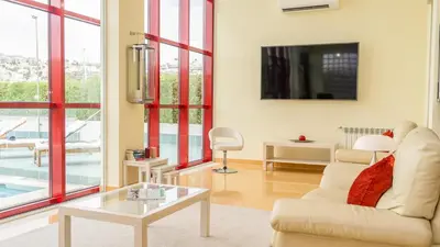 a living room with a couch and a table at Villa Dolce Vita by Algarve Vacation in Albufeira