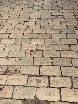 a brick sidewalk with writing on it at CASA NOAVA in Loulé