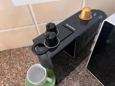 a coffee machine sitting on a counter with a cup at Old Village, 2 bedrooms, 5 ppl, Beach, Golf, Padel in Vilamoura