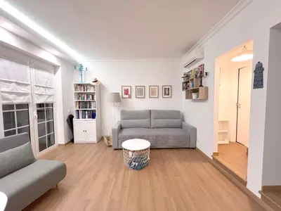 a living room with a couch and a table at Old Village, 2 bedrooms, 5 ppl, Beach, Golf, Padel in Vilamoura