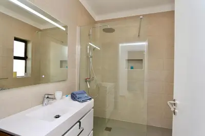 a bathroom with a shower with a sink and a shower at Fig Villa- CleverDetails, Sleep 8, Pool, Children Playground, Ténis court in Vilamoura