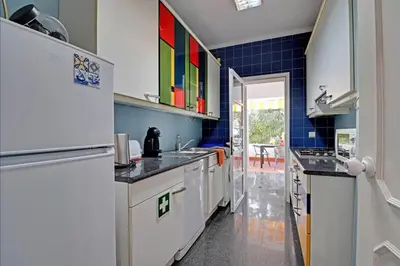 a living room with a dining room table and chairs at Marina Family Duplex with Pool in Quarteira