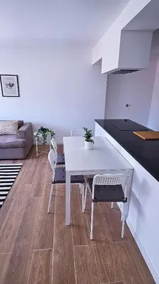 a white table and chairs in a living room at Carmo City Center 2 in Faro
