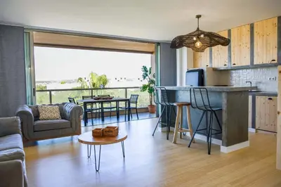 a living room with a couch and a table at Apartment Terracota By Dalma Portuguesa in Albufeira
