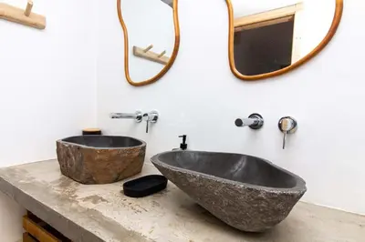 a bathroom with two sinks and a mirror on the wall at Apartment Terracota By Dalma Portuguesa in Albufeira