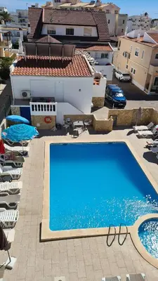 a large swimming pool on top of a building at APARTAMENTOS CABRITA in Olhos de Água