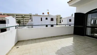 a balcony with a view of a building at Casa Catarina in Albufeira