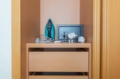 an empty dishwasher in a kitchen next to a window at BnB Homes Ocean view Apartment with comfortable Terrace, 2 Swimming pools & Tennis court in Albufeira