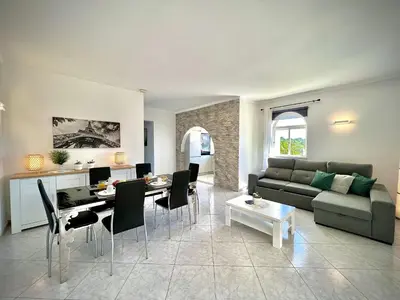 a living room with a couch and a table at Albufeira Marina Sol With Pool by Homing in Albufeira