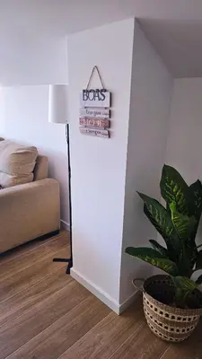 a room with a plant and a sign on a wall at Carmo City Center 3 in Faro