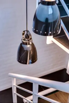 two lights are hanging over a white table at Blife Frankya private rooms in Faro