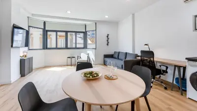 a living room with a table and chairs at Modern Retreat 1 in Faro by Lovelystay in Faro